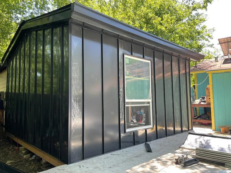 Black standing seam metal wall panels for Roof Inspection in Milltown